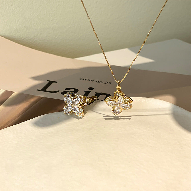 Roterende Klavertjevier Zirkonia Ring & Ketting