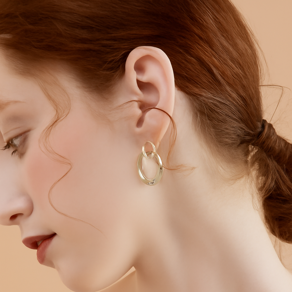 Vergulde geometrische oorbellen met glasinleg