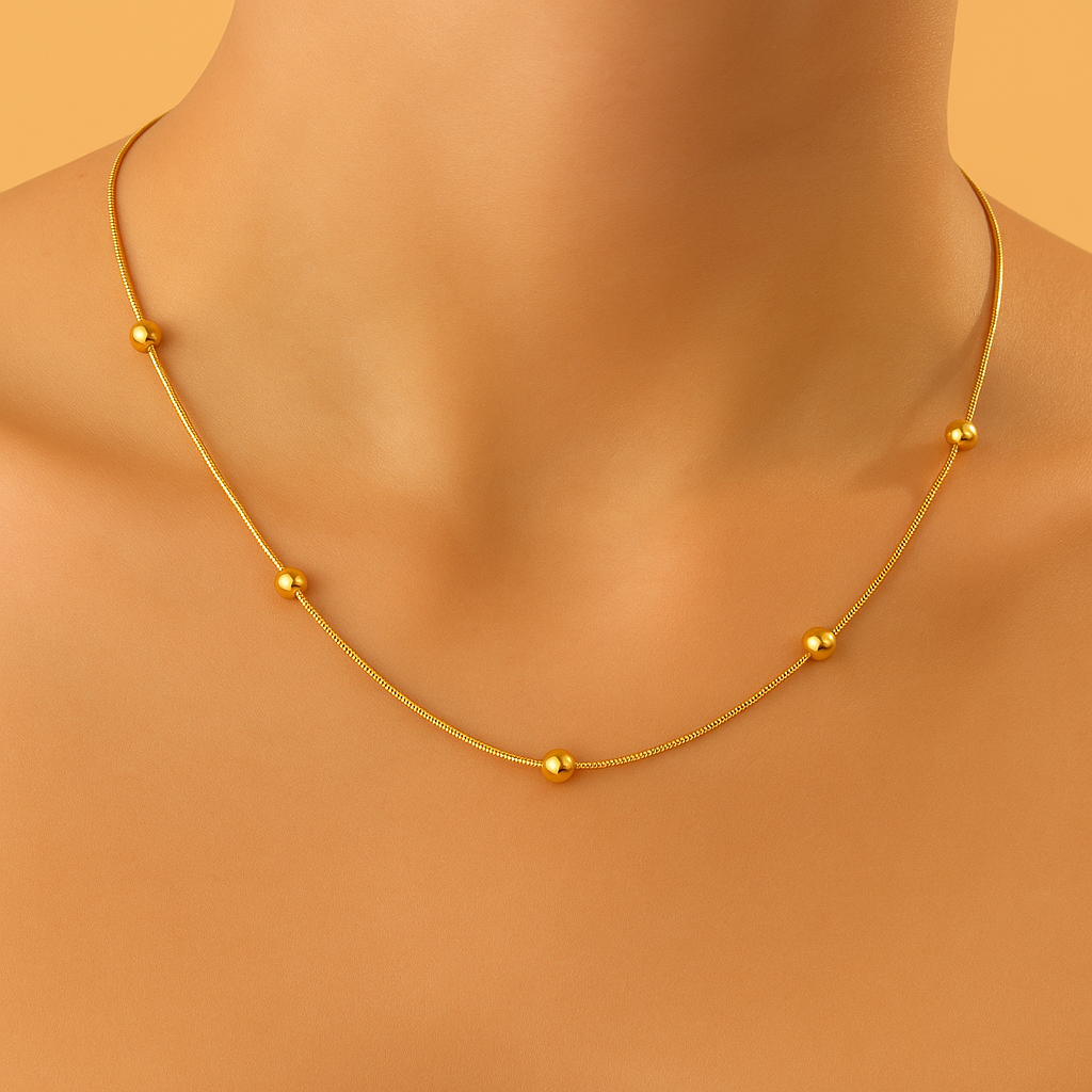 Verfijnde slangenbeen ketting - Gouden kraal detail