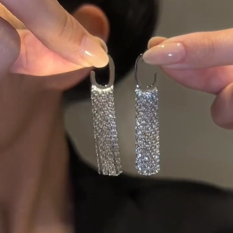 Elegante lange kwastoorbellen