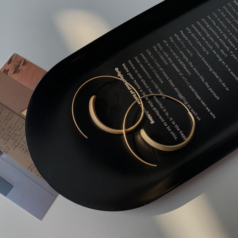 Grote geschwungen oorbellen