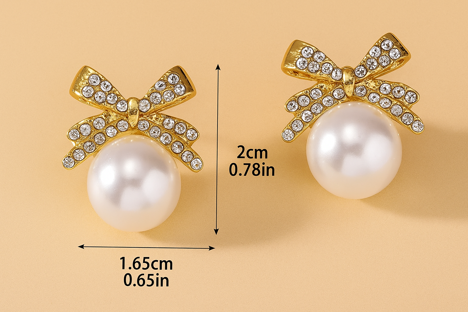 Sierlijke met strik ingelegde pareloorbellen