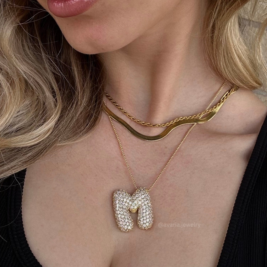 Bubbel initiaal diamanten ketting
